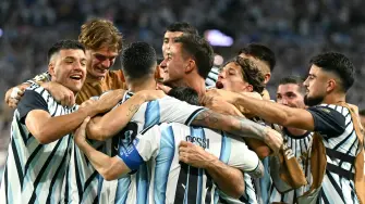 Argentina's defender #13 Cristian Romero celebrates with teammates scoring his team's third goal during the 2026 World Cup round of 32 football match between Argentina and Cape Verde at the Miami Stadium in Miami Gardens on July 3, 2026.  (Photo by CHANDAN KHANNA / AFP)