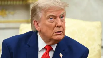 US President Donald Trump listens to questions from the press as he meets with Lebanese President Joseph Aoun in the Oval Office of the White House in Washington, DC, on July 21, 2026. (Photo by SAUL LOEB / AFP)