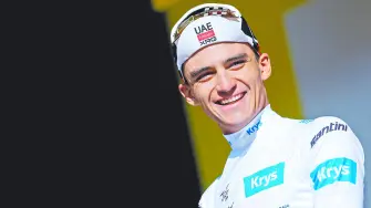 Cycling - Tour de France - Stage 18 - Voiron to Orcieres-Merlette - Voiron, France - July 23, 2026UAE Team Emirates XRG's Isaac Del Toro celebrates on the podium wearing the white jersey after stage 18 REUTERS/Gonzalo Fuentes