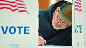 FILE PHOTO: Wisconsin resident Cary Pallas prepares to vote in the presidential primary election at the Central Assembly of God church polling place in Douglas County in Superior, Wisconsin, U.S. April 2, 2024. REUTERS/Erica Dischino/File Photo