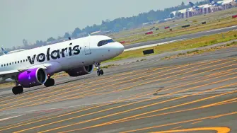 A Volaris airplane is pictured on the airstrip at Benito Juarez international airport in Mexico City, Mexico, May 9, 2022. REUTERS/Edgard Garrido
