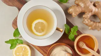 Ginger tea ingredients, healthy comforting and heating tea under simple recipe. Ginger tea and ingredients - lemon, honey.Top view. Flat lay. freshly from home growth organic garden. Food concept.
