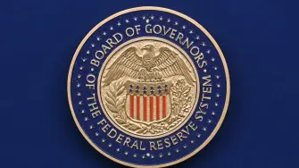 The seal of the US Federal Reserve Board of Governors is seen ahead of Chair Jerome Powell's news conference at the Federal Reserve headquarters, following the Federal Open Market Committee (FOMC) meeting in Washington, DC, on September 17, 2025. The US Federal Reserve on Wednesday lowered interest rates for the first time this year, flagging slower job gains and risks to employment as policymakers face heightened pressure under President Donald Trump. The Fed cut the benchmark lending rate by 25 basis points, to a range between 4.0 percent and 4.25 percent, while penciling in two more cuts this year. Only new Fed Governor Stephen Miran voted against this decision, preferring a larger rate reduction. (Photo by Jim WATSON / AFP)