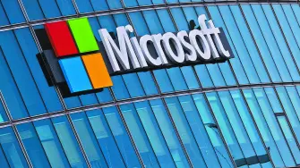 FILE PHOTO: A view shows a Microsoft logo at Microsoft offices in Issy-les-Moulineaux near Paris, France, March 21, 2025. REUTERS/Gonzalo Fuentes/File Photo