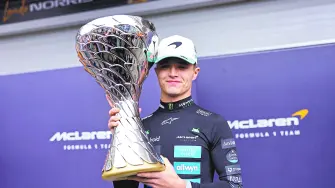 Formula One F1 - Sao Paulo Grand Prix - Autodromo Jose Carlos Pace, Sao Paulo, Brazil - November 9, 2025McLaren's Lando Norris celebrates with a trophy after winning the Sao Paulo Grand Prix REUTERS/Amanda Perobelli