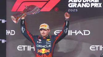 Red Bull's Max Verstappen celebrates with a trophy on the podium after winning the Abu Dhabi Grand Prix REUTERS/Amr Alfiky