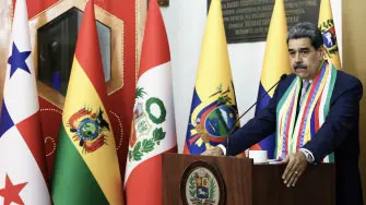 This handout picture released by the Venezuelan Presidency shows Venezuela's President Nicolas Maduro speaking during an event marking the anniversary of the death of Liberator Simon Bolivar in Caracas on December 17, 2025. Venezuela struck a defiant note on December 17, insisting that its crude oil exports were not impacted by US President Donald Trump's announcement of a potentially crippling blockade. (Photo by Wendys Olivo / Venezuelan Presidency / AFP) / RESTRICTED TO EDITORIAL USE - MANDATORY CREDIT "AFP PHOTO / VENEZUELAN PRESIDENCY / WENDYS OLIVO" - NO MARKETING NO ADVERTISING CAMPAIGNS - DISTRIBUTED AS A SERVICE TO CLIENTS
