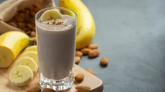 Banana almond smoothie on dark background