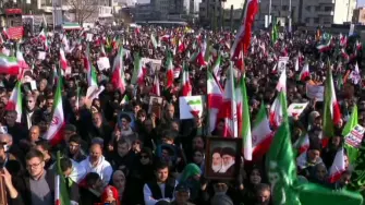 This grab taken from handout video footage released by Iran Press on January 12, 2026, shows pro-government demonstrators rallying in Enghelab (Revolution) Square in central Tehran in a show of support for the Islamic Republic. Iranian authorities on January 12, 2026, sought to regain control of the streets with mass nationwide rallies in the wake of protests on a scale unprecedented in recent years, as alarm grew over a deadly crackdown. (Photo by IRAN PRESS / AFP) / - Israel OUT / - ISRAEL OUT / XGTY/RESTRICTED TO EDITORIAL USE - MANDATORY CREDIT AFP -  SOURCE: IRAN PRESS - NO MARKETING - NO ADVERTISING CAMPAIGNS -  DISTRIBUTED AS A SERVICE TO CLIENTS - NO RESALES- NO ACCESS ISRAEL MEDIA/PERSIAN LANGUAGE TV STATIONS OUTSIDE IRAN/STRICTLY NO ACCESS BBC PERSIAN/ VOA PERSIAN/MANOTO-1 TV/IRAN INTERNATIONAL / RADIO FARDA /NO RADIO FARDA /