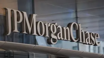 (FILES) Exterior view of the logo adorning the new JPMorgan Chase global headquarters building at 270 Park Avenue in New York City on November 13, 2025. US President Donald Trump sued JPMorgan Chase and CEO Jamie Dimon on January 22, alleging he was wrongly "debanked" for political reasons, according to a court announcement.Trump is seeking at least $5 billion in damages in a civil suit filed in a Florida state court, according to US media, including a Fox Business article posted by Trump on social media. (Photo by ANGELA WEISS / AFP)