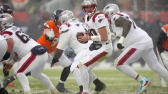 Jan 25, 2026; Denver, CO, USA; New England Patriots quarterback Drake Maye (10) drops back to pass against the Denver Broncos during the second half in the 2026 AFC Championship Game at Empower Field at Mile High. Mandatory Credit: Ron Chenoy-Imagn Images