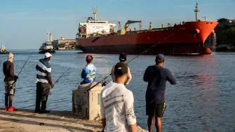 The crude oil tanker Alicia arrives at Havana bay on March 26, 2024. (Photo by YAMIL LAGE / AFP)
