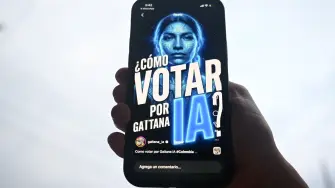 A cellphone shows "Gaitana", an artificial intelligence represented on social media as a woman with blue skin and a feather loincloth, that will participate as a candidate for the Colombia's legislative elections in Bogota on February 12, 2026. The artificial intelligence "Gaitana" defines itself as an "environmentalist" and "animal rights activist", and will appear on one of the ballots as an independent candidate for one of the seats reserved for indigenous communities in Colombia's legislative elections on March 8, 2026. (Photo by Raul ARBOLEDA / AFP)
