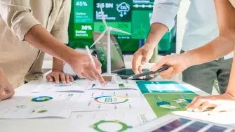 diversity team discussion focused on ESG (environment,social,governance)  for net zero goals in a sustainable green office