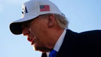 JOINT BASE ANDREWS, MARYLAND - MARCH 13: U.S. President Donald Trump speaks to the media before boarding Air Force One on March 13, 2026 at Joint Base Andrews, Maryland. Trump is traveling to Florida to spend the weekend at his Mar-a-Lago resort.   Nathan Howard/Getty Images/AFP (Photo by Nathan Howard / GETTY IMAGES NORTH AMERICA / Getty Images via AFP)