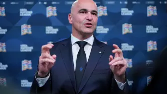 Portugal's national football team head coach Roberto Martinez talks to the press after attending the 2026/27 UEFA Nations League league phase draw ceremony as part of the European football governing body's 50th annual Ordinary Congress in Brussels on February 12, 2026. (Photo by Pau BARRENA / AFP)