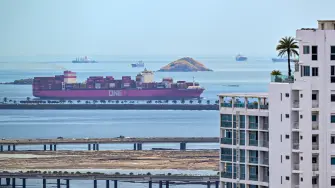 The ONE Orinoco container ship, sailing under the flag of Singapore, enters the Panama Canal from the Pacific side in Panama City on March 25, 2026. (Photo by Martin BERNETTI / AFP)