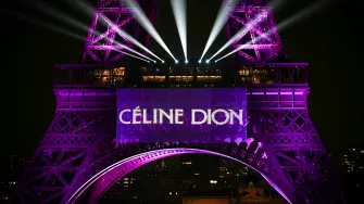 This photograph shows the Eiffel Tower illuminated to celebrate the 58th Birthday of Canadian singer Celine Dion, in Paris, on March 30, 2026. To celebrate her 58th birthday, Celine Dion announced on the evening of March 30, 2026, a series of ten concerts in September and October in Paris, officially marking her return after six years away from the stage. (Photo by Anna KURTH / AFP)