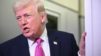 US President Donald Trump speaks to reporters aboard Air Force One en route to Joint Base Andrews, Maryland, on March 29, 2026. US President Donald Trump is returning to White House after spending the weekend at his Mar-A-Lago residence. (Photo by Mandel NGAN / AFP)