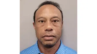 This handout mugshot released on March 27, 2026 provided by the Martin County Sheriff's Office shows the mugshot of US golfer Tiger Woods, 50, who was arrested in Jupiter Island, Florida on March 27, 2026. The golf icon was arrested and charged with driving under the influence after a rollover crash near his Florida home, authorities said. (Photo by HANDOUT / Florida Department of Corrections / AFP) / RESTRICTED TO EDITORIAL USE - MANDATORY CREDIT 