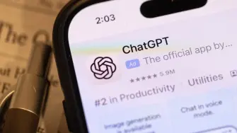 CHICAGO, ILLINOIS - MARCH 03: The ChatGPT app by OpenAI is shown on a cell phone on March 03, 2026 in Chicago, Illinois. OpenAI reworked an agreement with the Pentagon governing the Defense Departments use of its AI services after concerns were raised that the military would use OpenAIs systems for domestic surveillance.   Scott Olson/Getty Images/AFP (Photo by SCOTT OLSON / GETTY IMAGES NORTH AMERICA / Getty Images via AFP)