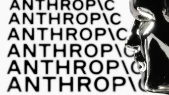 This photograph shows a figurine in front of the logo of the US artificial intelligence safety and research company Anthropic during a photo session in Paris on February 13, 2026. (Photo by JOEL SAGET / AFP)