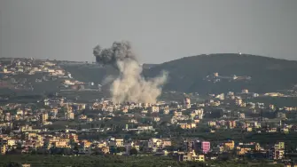 A photograph taken from the southern Lebanese area of Tyre shows smoke as it rises from the site of Israeli airstrikes that targeted villages on southern Lebanon on April 16, 2026. The US President announced that Israel and Lebanon have agreed to a 10-day ceasefire starting on April 6, though there was no indication if Iran-backed Hezbollah party was on board. (Photo by Kawnat HAJU / AFP)