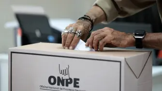 A man casts his ballot during the presidential election at a polling station in Lima on April 12, 2026. Hours-long delays marred Peru's presidential and legislative elections on Sunday, as voters sought to end political chaos that has seen a string of presidents ousted or jailed. (Photo by Connie FRANCE / AFP)