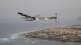 (FILES) The Solar Impulse 2 solar powered airplane flies off Kapolei, Hawaii, on March 3, 2016 on a all-day test flight. Bertrand Piccards pioneering aircraft, which completed a round-the-world flight in 2016 using electric batteries, crashed into the sea in the Gulf of Mexico after being converted into a drone, according to its owner in the United States. In July 2016, Solar Impulse 2 completed a historic round-the-world flight in Abu Dhabi, flying day and night on solar power and without a drop of fuel after a journey of 23 actual flight days and 43,041 km. (Photo by Eugene TANNER / AFP)