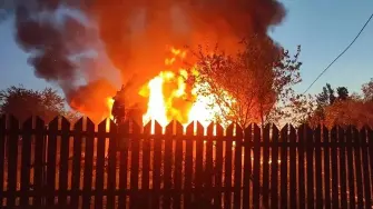This handout photograph posted on the official Telegram channel of Moscow Region Governor Andrey Vorobyov on May 17, 2026 shows a burning building following an air attack at an undisclosed location in the Moscow region, amid the ongoing Russian-Ukrainian conflict. A huge wave of more than 500 Ukrainian drones attacked Russia overnight, killing three people in the Moscow region, authorities said on May, 17, 2026. Air defences shot down 556 drones in more than a dozen regions, including Moscow, Russia's defence ministry said, in one of the largest Ukrainian barrages of the ongoing conflict so far. (Photo by Handout / TELEGRAM / @vorobiev_live / AFP) / RESTRICTED TO EDITORIAL USE - MANDATORY CREDIT 