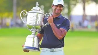 May 17, 2026; Newtown Square, Pennsylvania, USA; Aaron Rai poses with the trophy after winning the final round of the PGA Championship golf tournament. Mandatory Credit: Bill Streicher-Imagn Images