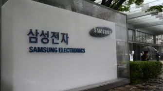 Signage of Samsung Electronics is displayed outside the company's Seocho building in Seoul on May 20, 2026. A planned strike at South Korean chip giant Samsung Electronics will go ahead from May 21, its union said, after talks on bonus payouts collapsed, raising concerns over a disruption to the country's key semiconductor industry. (Photo by Jung Yeon-je / AFP)