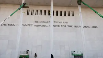 FILE PHOTO: The newly added lettering for U.S. President Donald Trump's name is displayed at the facade of the John F. Kennedy Center for the Performing Arts, a day after its board announced it would rename the institution The Donald J. Trump and The John F. Kennedy Memorial Center for the Performing Arts, in Washington, D.C., U.S., December 19, 2025. REUTERS/Kevin Lamarque/File Photo