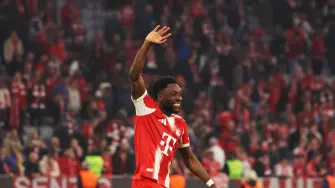 Bayern Munich's Canadian defender #19 Alphonso Davies greets the fans after the end of the UEFA Champions League quarter-final second leg football match between FC Bayern Munich and Real Madrid in Munich, southern Germany, on April 15, 2026. (Photo by Karl-Josef HILDENBRAND / AFP)