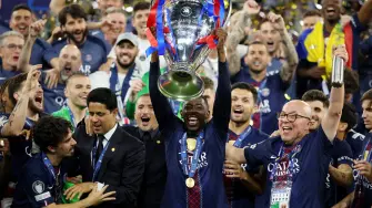 Soccer Football - UEFA Champions League - Final - Paris St Germain v Arsenal - Puskas Arena, Budapest, Hungary - May 30, 2026 Paris St Germain's Ousmane Dembele with the trophy as he celebrates with players and staff after winning the UEFA Champions League REUTERS/Phil Noble     TPX IMAGES OF THE DAY