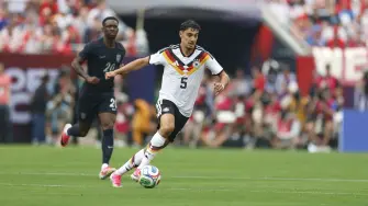 Germany's Aleksandar Pavlovic runs with the ball during the international friendly football match between USA and Germany at Soldier Field in Chicago, Illinois, on June 6, 2026. (Photo by KAMIL KRZACZYNSKI / AFP)