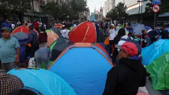 Teachers from Mexico's National Coordination of Education Workers (CNTE) union set up tents in the streets near the Zocalo square during a protest to demand better wages and pensions, under the slogan "If there's no solution, the ball won't roll," ahead of the 2026 FIFA World Cup, in Mexico City, Mexico, June 1, 2026. REUTERS/Luis Cortes