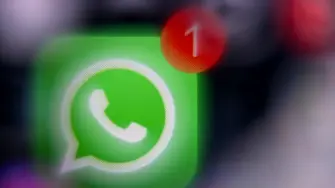 This illustration photograph taken on December 1, 2025, shows the logo of US instant messaging software Whatsapp displayed on a smartphone's screen, in Frankfurt am Main, western Germany. (Photo by Kirill KUDRYAVTSEV / AFP)