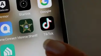 MIAMI, FLORIDA - APRIL 24: In this photo illustration, the TikTok app is displayed on an iPhone screen on April 24, 2024 in Miami, Florida. President Joe Biden signed a foreign aid package that includes a bill that would ban TikTok if China-based parent company ByteDance fails to sell the app to an American company within a year. (Photo illustration by Joe Raedle/Getty Images) (Photo by JOE RAEDLE / GETTY IMAGES NORTH AMERICA / Getty Images via AFP)