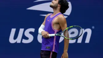 Tennis - U.S. Open - Flushing Meadows, New York, United States - August 25, 2026 Spain's Carlos Alcaraz reacts during his mixed doubles round of 16 match with Serena Williams of the U.S. against Britain's Lloyd Glasspool and New Zealand's Erin Routliffe IMAGN IMAGES via Reuters/Mike Frey