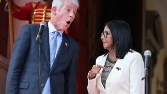 Venezuela's interim President Delcy Rodriguez (R) and US Energy Secretary Chris Wright (L) talk as they give a press conference after the signing of an oil agreement at the Miraflores Presidential Palace in Caracas on September 2, 2026. US Energy Secretary Chris Wright oversaw the signing of deals worth "tens of billions of dollars" between Venezuela and oil majors Chevron and ENI as well as with energy company GE Vernova on September 2, 2026. (Photo by Juan BARRETO / AFP)