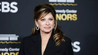 FILE PHOTO: Maria Bartiromo poses on the red carpet for the 2025 Kennedy Center Honors at the John F. Kennedy Center for the Performing Arts in Washington, D.C., U.S., December 7, 2025. REUTERS/Jeenah Moon/File Photo