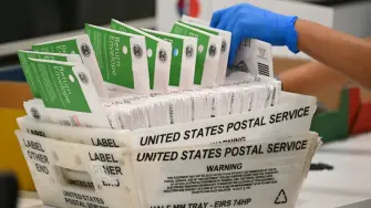 An election worker processes mail-in ballots at the Los Angeles County Ballot Processing Center during California's state primary election in the City of Industry, California, on June 2, 2026. Californians go to the polls Tuesday in the first round of voting for a new governor, with a tight three-way race for two run-off spots, while people in Los Angeles will also be voting for a new mayor. The state's so-called "jungle primary" pits all comers against each other -- regardless of party -- with the top two vote-getters advancing to the November general election to replace term-limited Governor Gavin Newsom. (Photo by Patrick T. Fallon / AFP)