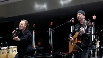 Bono and The Edge of U2 perform during the opening of the Barack Obama Presidential Center in Chicago, Illinois, on June 18, 2026. (Photo by Kamil Krzaczynski / AFP)