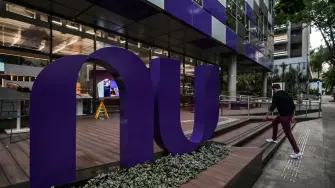 View of the logo of Brazilian FinTech Nubank outside its headquarters, in Sao Paulo, Brazil, on January 30, 2026. Nubank has received initial approval to operate as a bank in the United States, after becoming, in just over a decade, one of the most valuable companies in Latin America. (Photo by Nelson ALMEIDA / AFP)