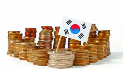 South Korea flag waving with stack of money coins