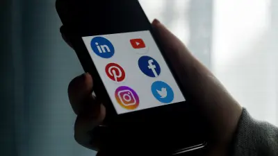 This illustration picture shows social media applications logos from Linkedin, YouTube, Pinterest, Facebook, Instagram and Twitter displayed on a smartphone in Arlington, Virginia on May 28, 2020. Trump is expected to sign an executive order on May 28, 2020, after threatening to shutter social media platforms following Twitter's move to label two of his tweets misleading. (Photo by Olivier DOULIERY / AFP)