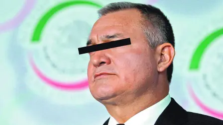 FILE PHOTO: Mexico's Public Security Minister Genaro Garcia Luna attends a meeting with the Human Rights commission at the Senate in Mexico City November 29, 2012. REUTERS/Tomas Bravo/File Photo