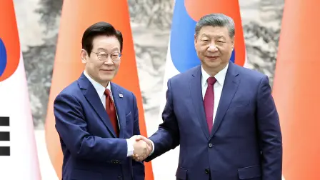 Chinese President Xi Jinping and South Korean President Lee Jae Myung shake hands at the Great Hall of the People in Beijing, China January 5, 2026. China Daily via REUTERS ATTENTION EDITORS - THIS PICTURE WAS PROVIDED BY A THIRD PARTY. CHINA OUT. NO COMMERCIAL OR EDITORIAL SALES IN CHINA.