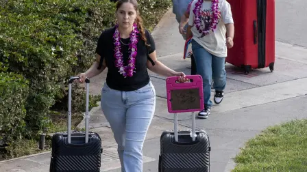 Visitors with their bags in tow leave the Ala Way Harbor, Waikiki, Oahu, Hawaii on July 29, 2025, after an 8.7 earthquake off of Russia's far east prompted tsunami alerts. A powerful 8.7 magnitude earthquake off Russia's far east has prompted tsunami alerts across parts of the Pacific including Japan, Hawaii, Russia and Ecuador, and warnings along the California coast, US authorities said late on July 29. The massive temblor triggered warnings of waves up to three metres (10 feet) possibly hitting the coasts of Russia, Hawaii and even Ecuador and Chile along South America's west coast, according to the US Pacific Tsunami Warning Center based in Honolulu, Hawaii. (Photo by Eugene Tanner / AFP)